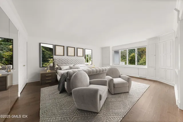 a bathroom with a sink a mirror and a shower