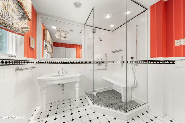 a bedroom with a bed a couch and window