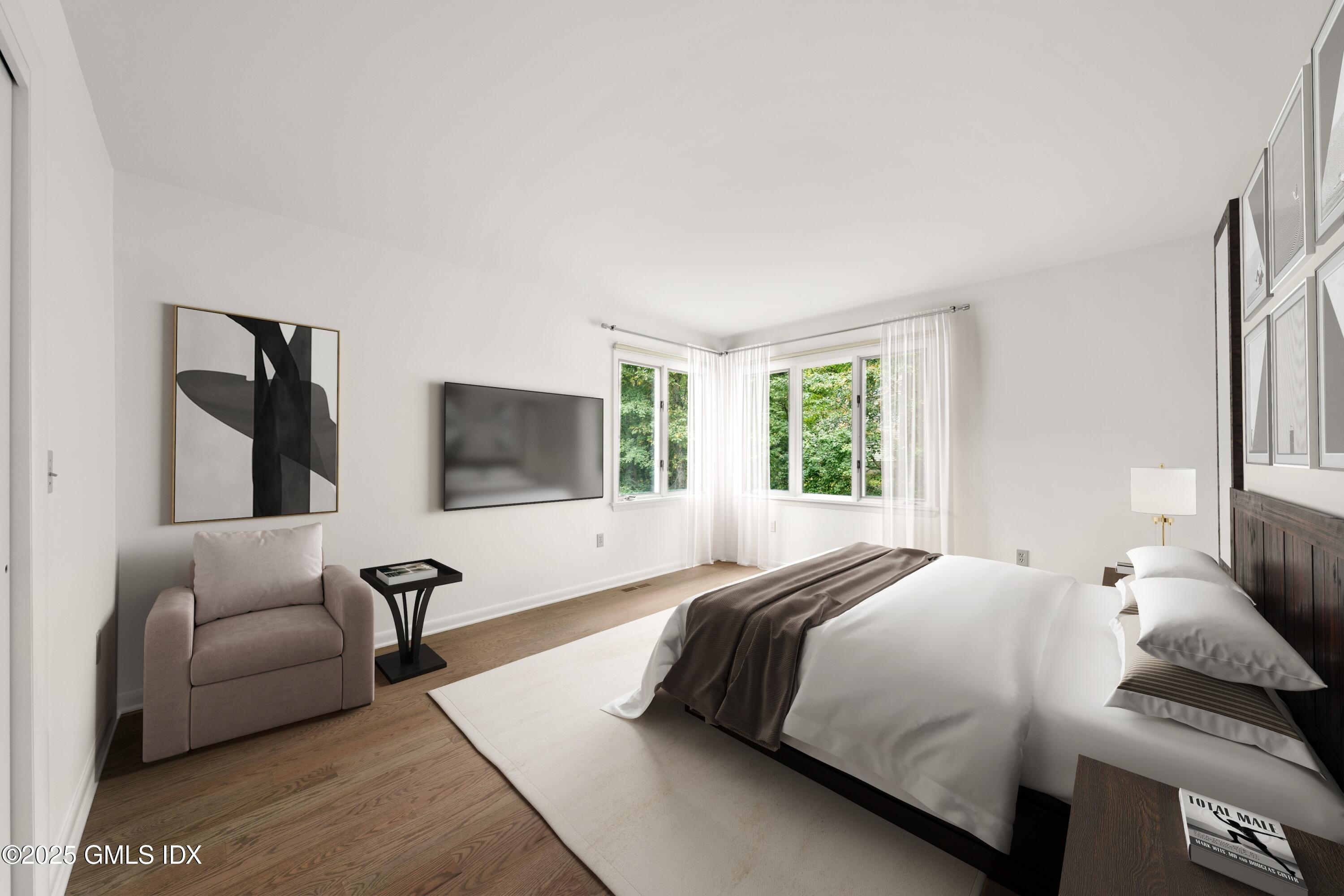 21 Harkim Road Greenwich, CT 06831 - Photo 32 of 40 a bedroom with a bed a couch and window