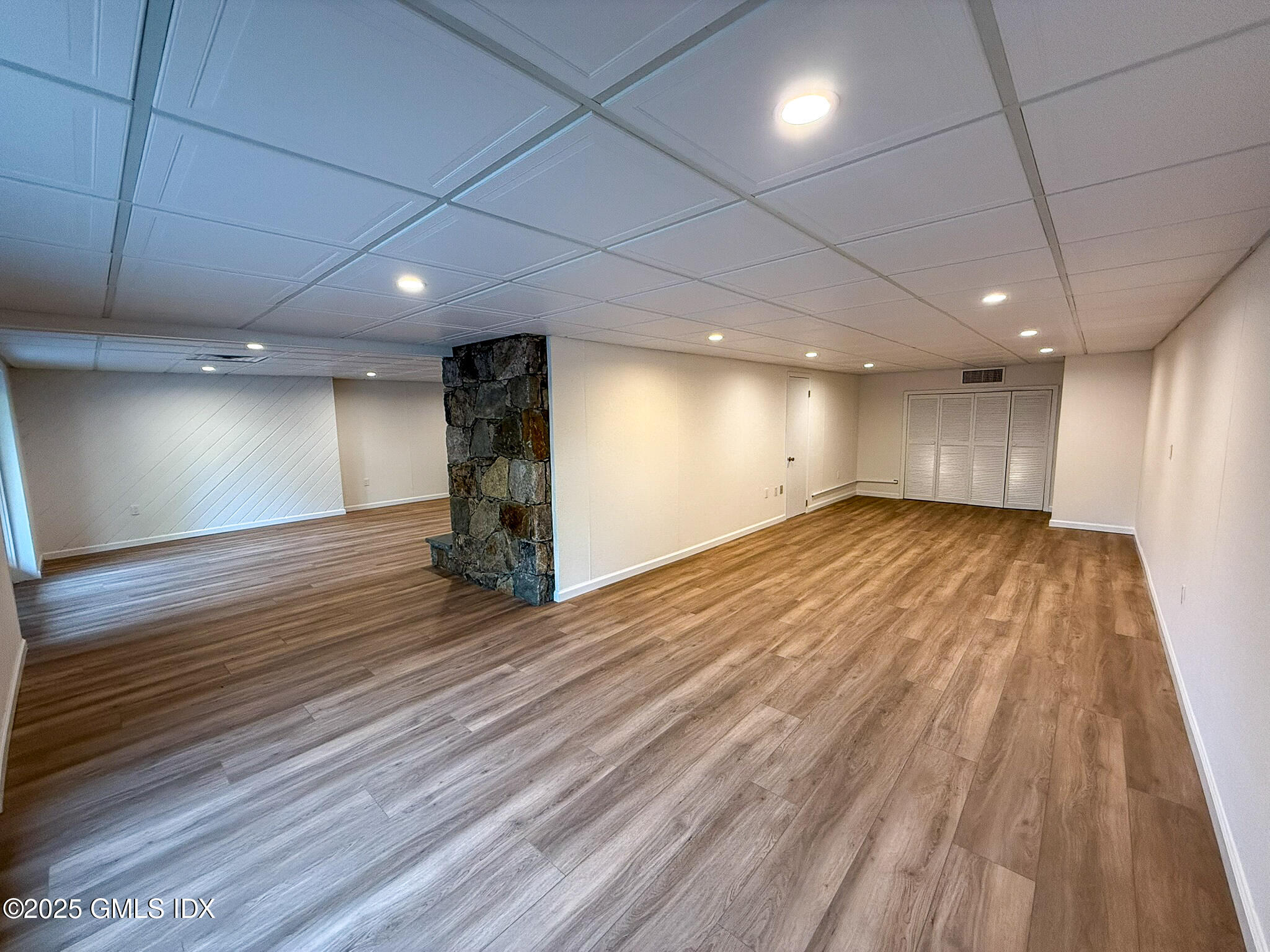 21 Harkim Road Greenwich, CT 06831 - Photo 38 of 40 a view of empty room with wooden floor