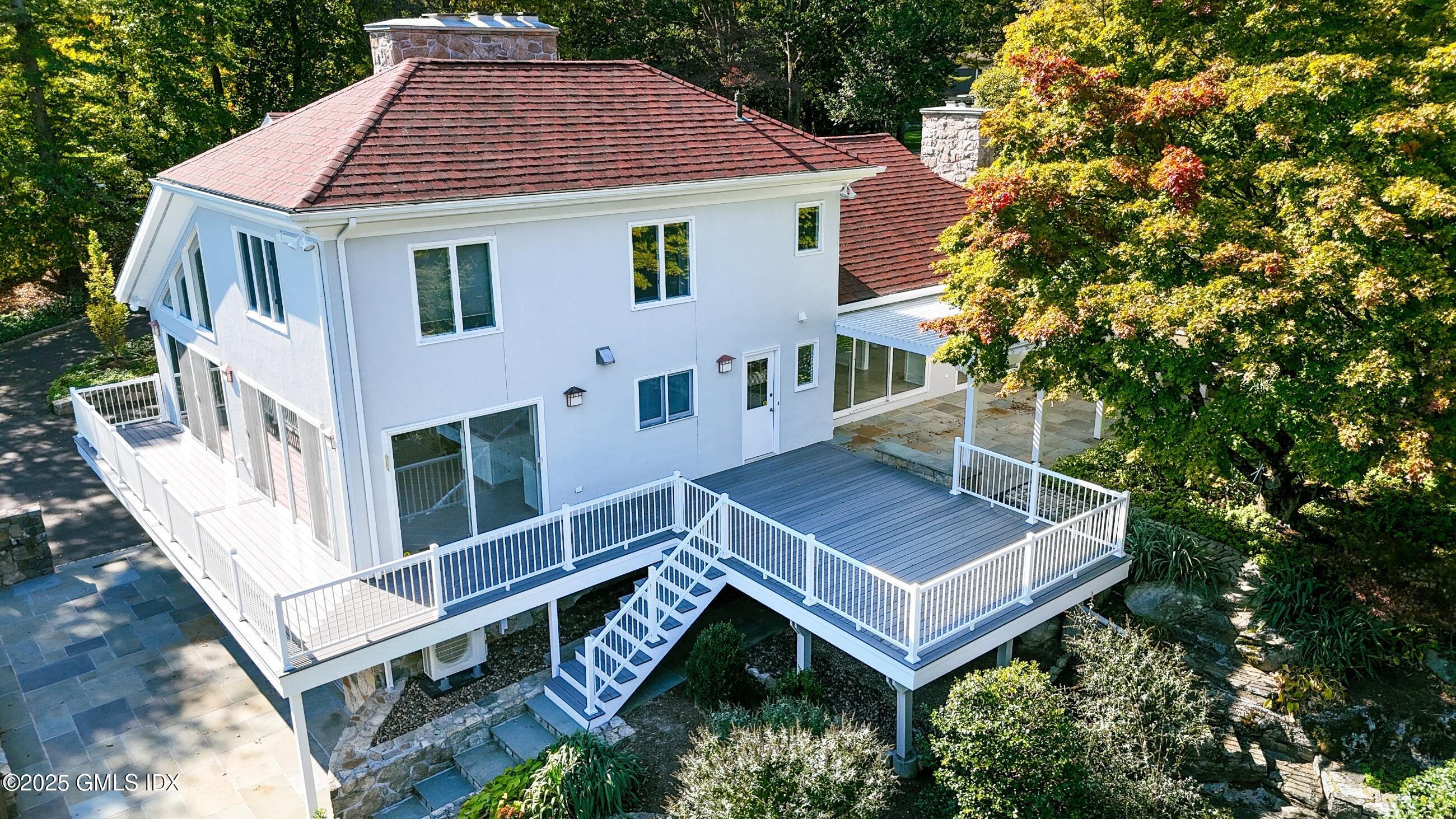 21 Harkim Road Greenwich, CT 06831 - Photo 40 of 40 a view of house with a yard and deck area