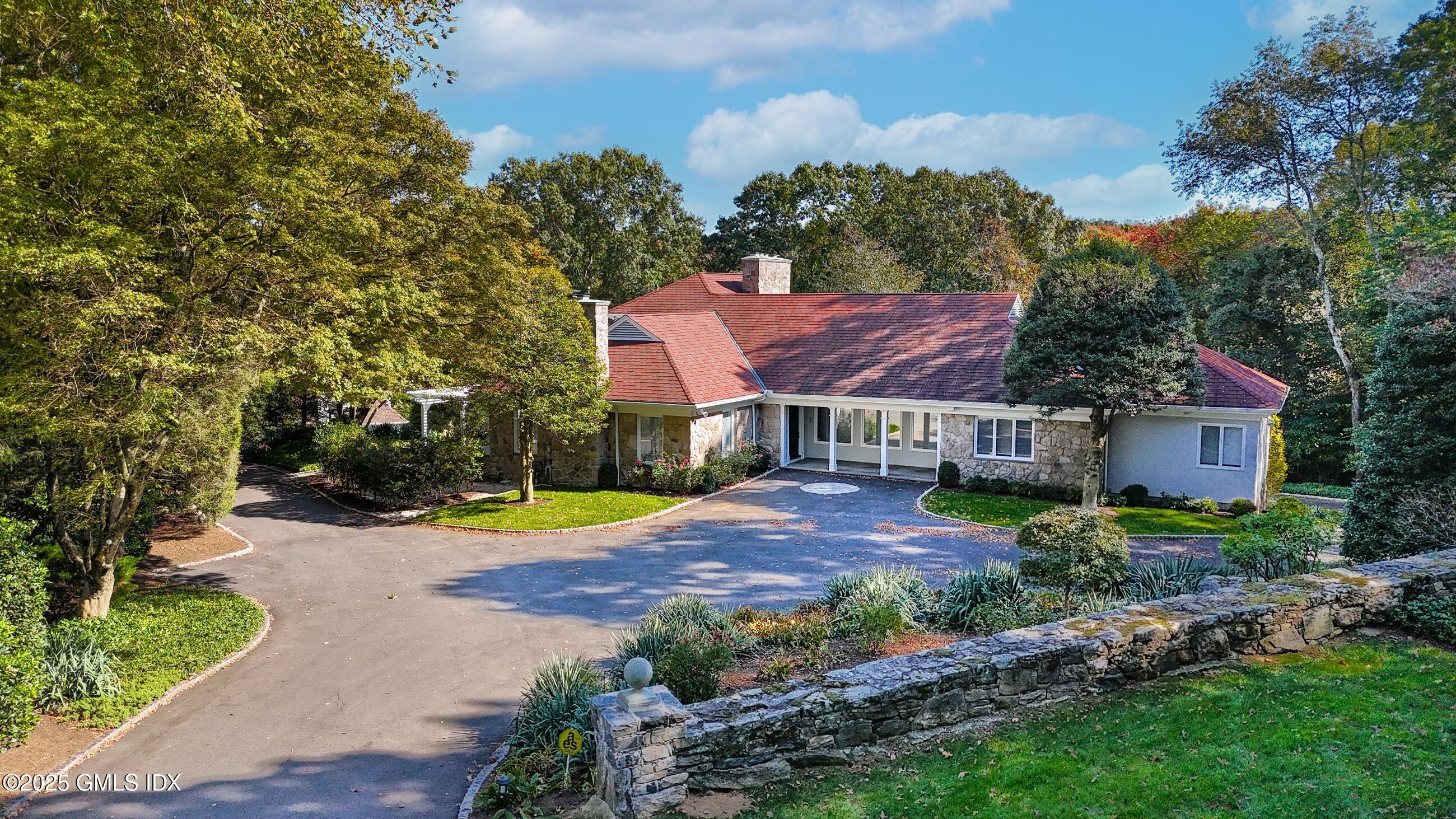 21 Harkim Road Greenwich, CT 06831 - Photo 5 of 40 a view of a house with a yard