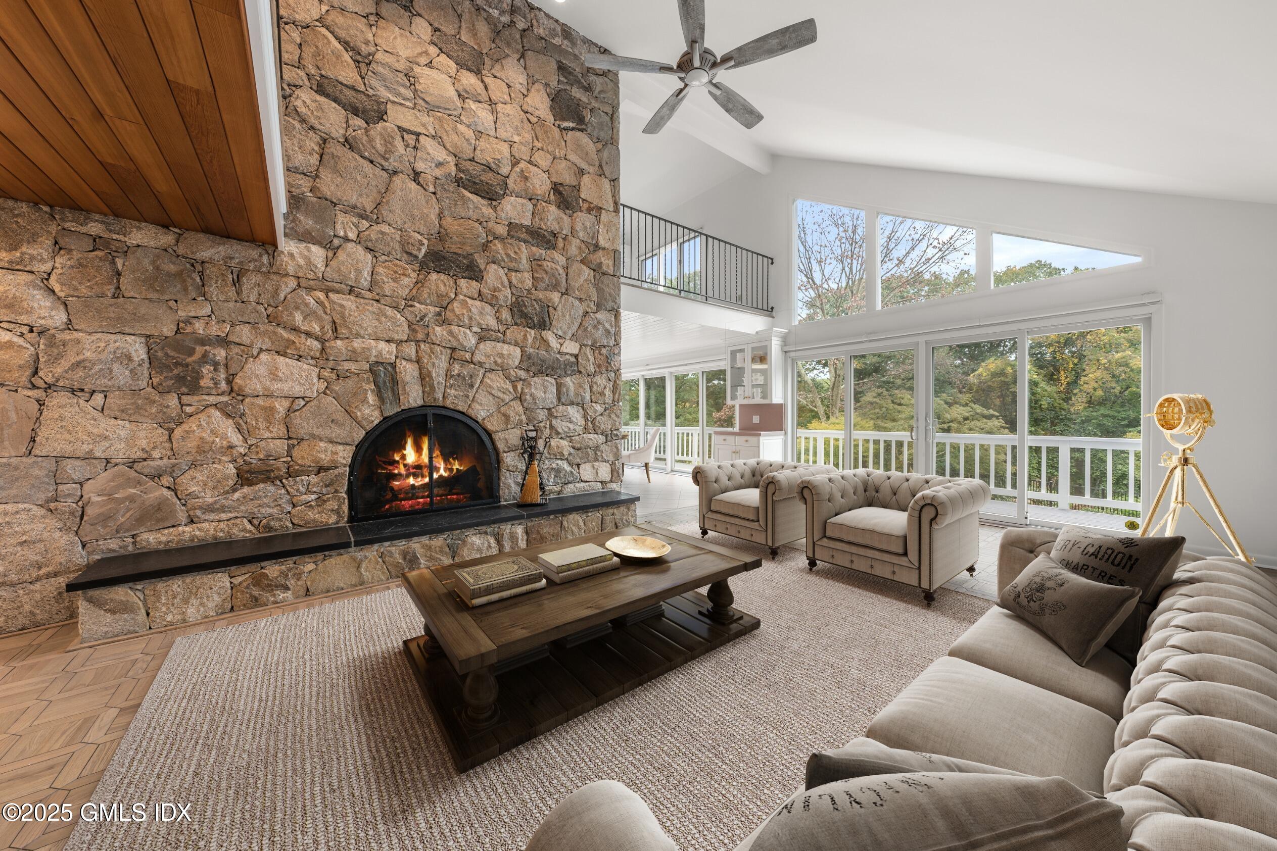 21 Harkim Road Greenwich, CT 06831 - Photo 8 of 40 a living room with furniture and a fireplace