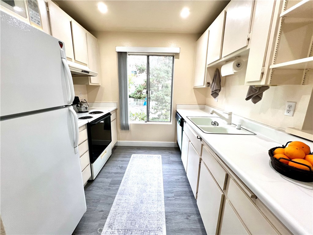 11108 Summertime Lane Culver City, CA 90230 - Photo 5 of 35 a kitchen with a sink a stove and a refrigerator