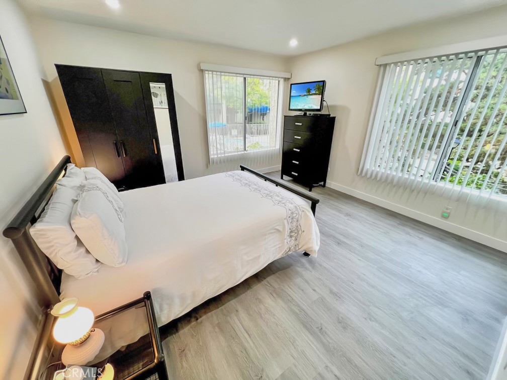 11108 Summertime Lane Culver City, CA 90230 - Photo 9 of 35 a bedroom with a bed and large windows