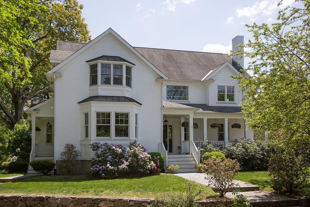 front view of a house with a yard