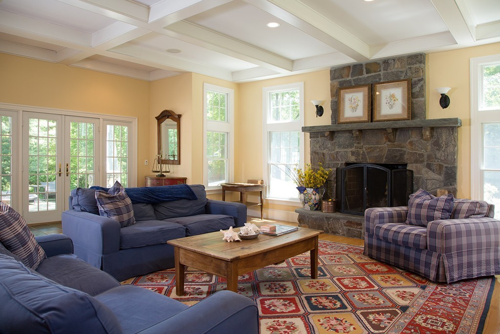 73 Smith Street Wellesley, MA 02482 - Photo 4 of 9 a living room with furniture fireplace and a large window