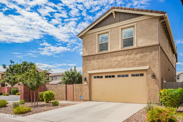 a view of backyard with patio