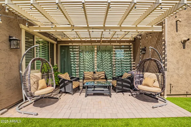 a view of a backyard with sitting area