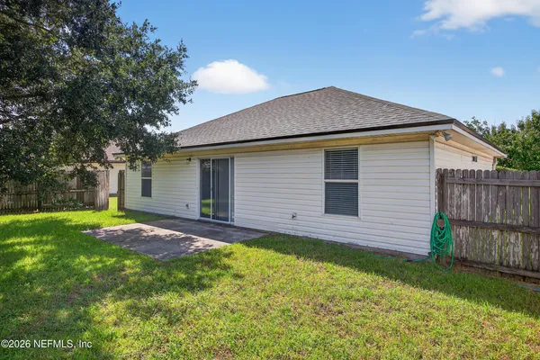 a view of front of house with a yard
