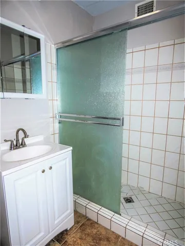 a bathroom with a sink and mirror