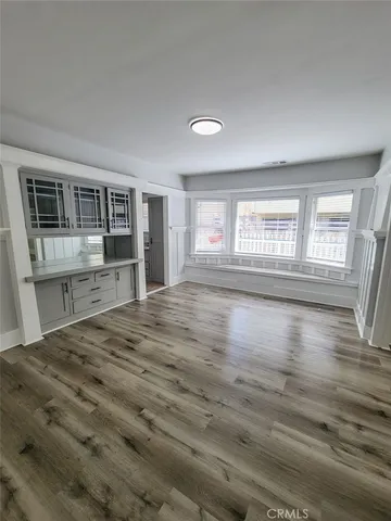 a view of a kitchen with an empty space and a window