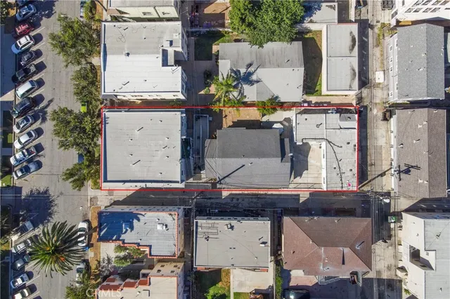 an aerial view of residential houses with outdoor space