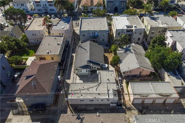 an aerial view of multiple houses with outdoor space