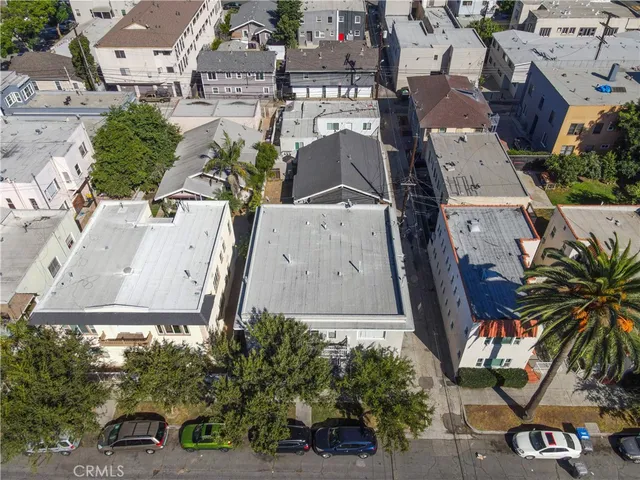 an aerial view of residential houses with outdoor space