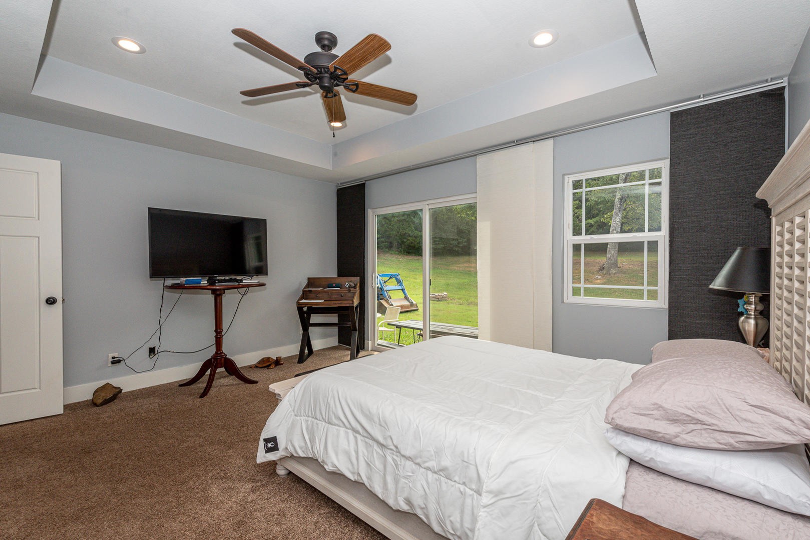 7299 Niles Ferry Road Greenback, TN 37742 - Photo 26 of 38 a bedroom with a bed and a flat screen tv
