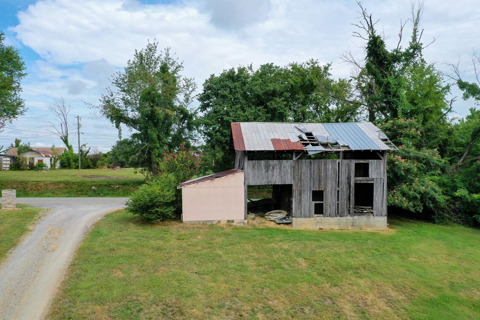 7299 Niles Ferry Road Greenback, TN 37742 - Photo 38 of 38 a view of a house with backyard porch and garden