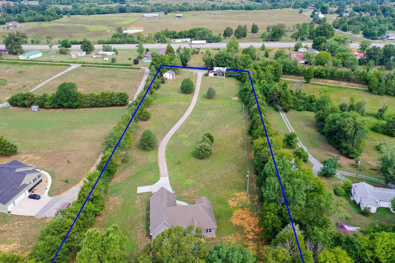 7299 Niles Ferry Road Greenback, TN 37742 - Photo 6 of 38 an aerial view of a house with a yard and lake view