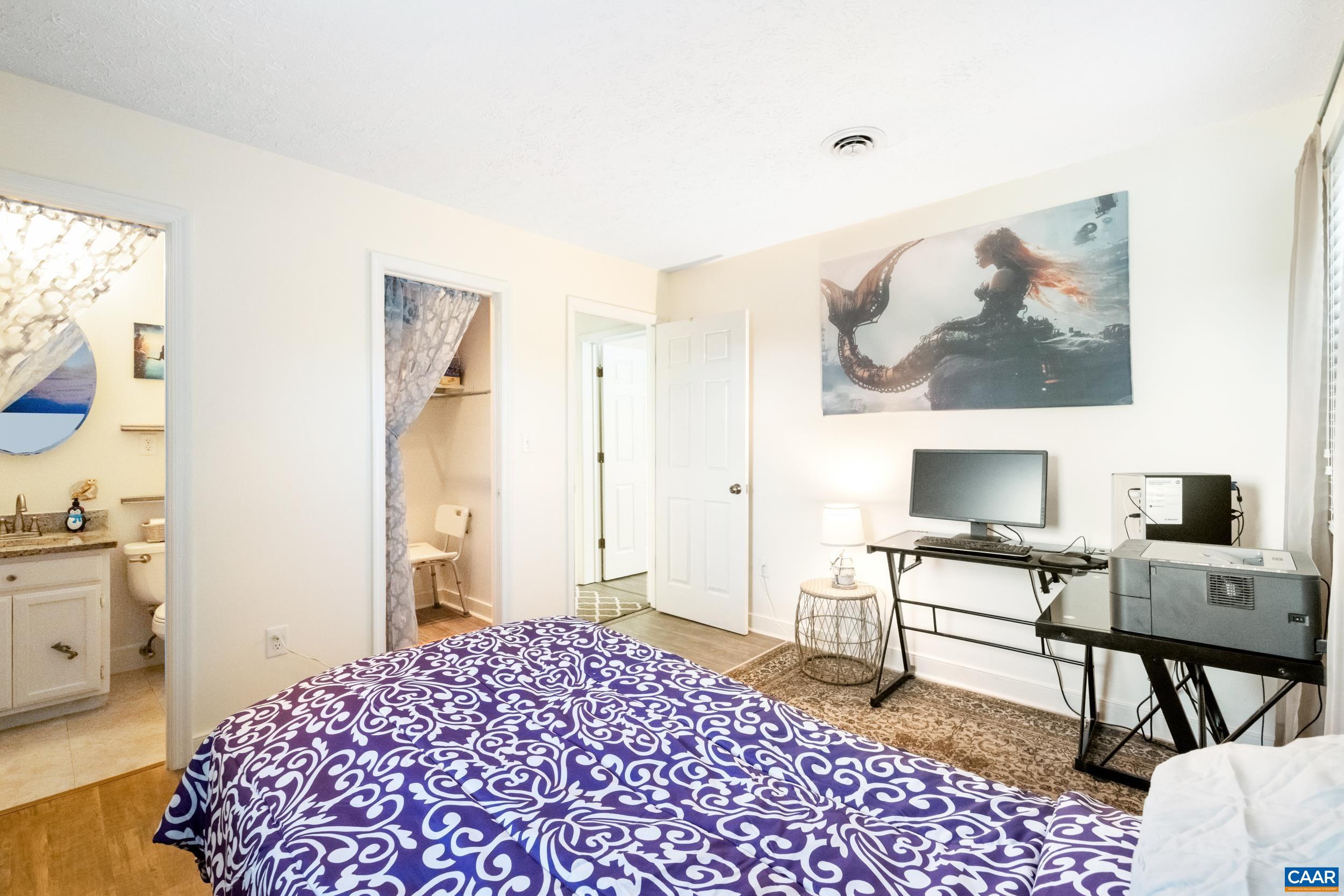 518 Jester Lane Charlottesville, VA 22911 - Photo 22 of 53 a bedroom with a bed and a desk