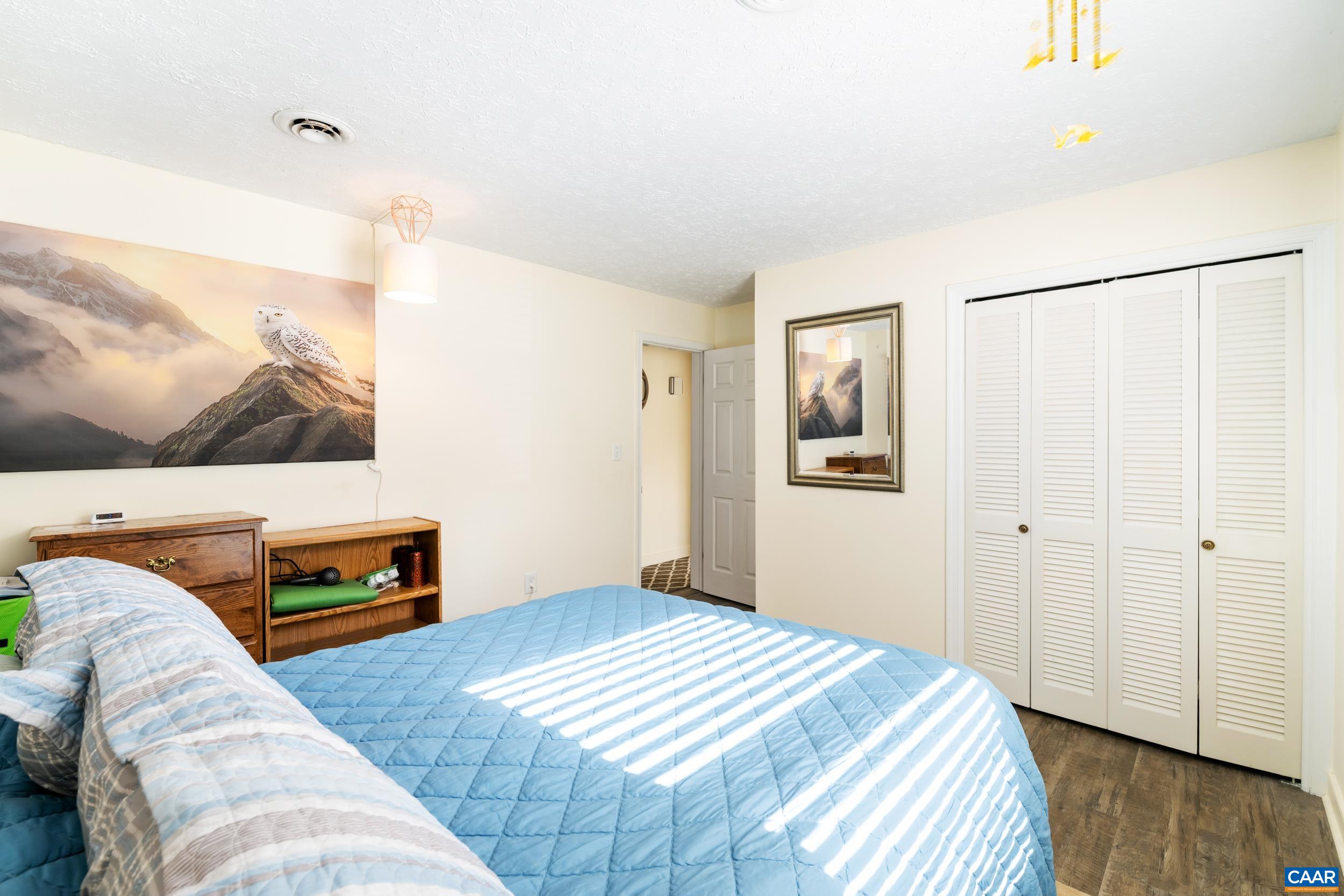 518 Jester Lane Charlottesville, VA 22911 - Photo 26 of 53 a bedroom with a bed and a flat screen tv