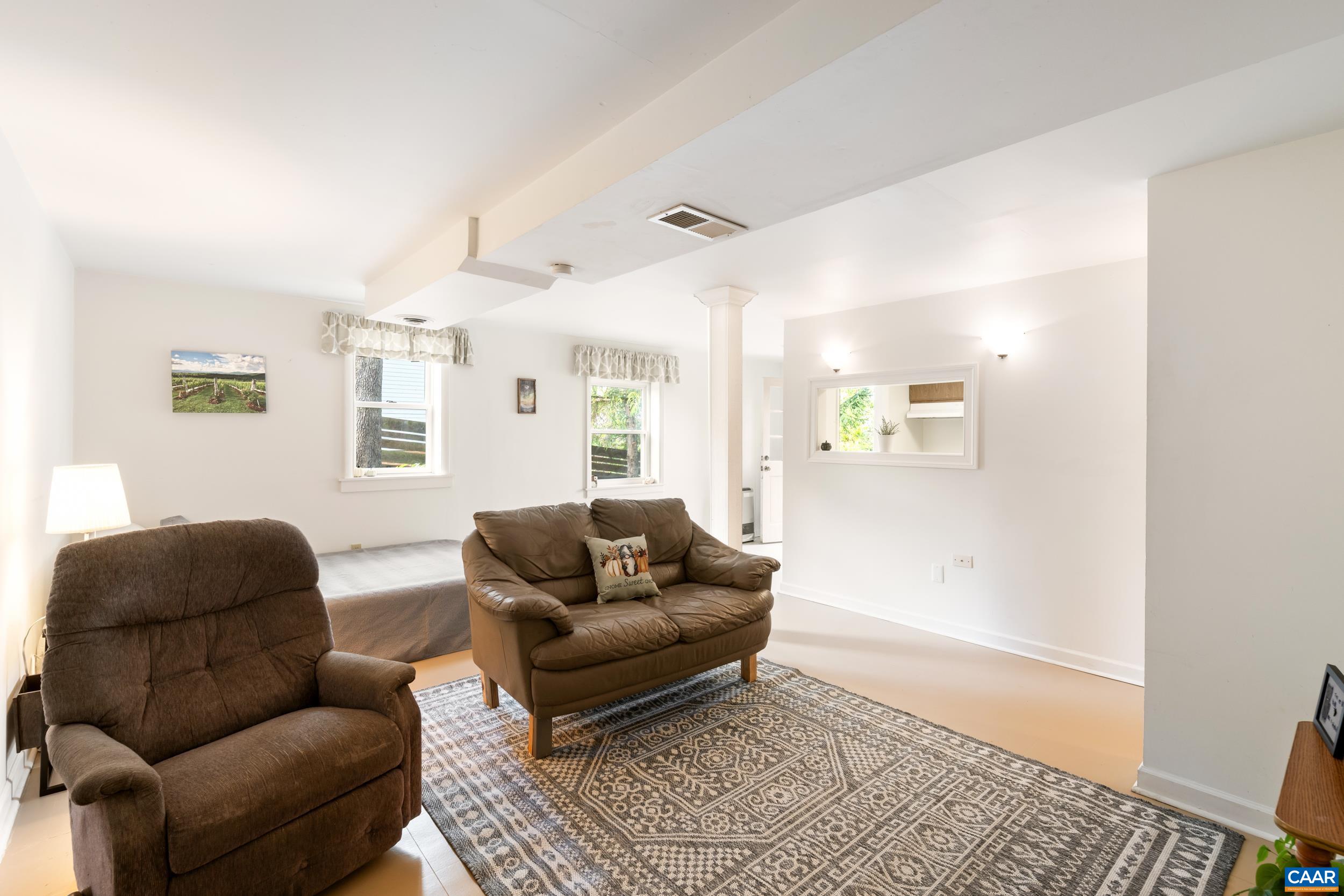 518 Jester Lane Charlottesville, VA 22911 - Photo 34 of 53 a living room with furniture and a rug