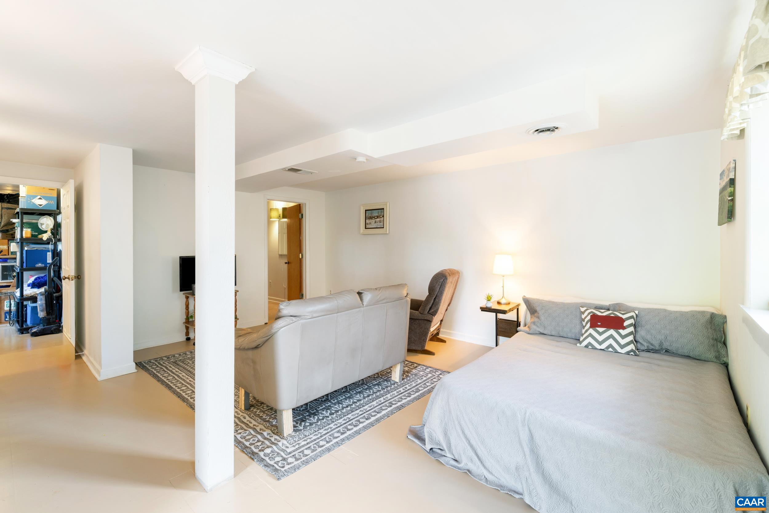 518 Jester Lane Charlottesville, VA 22911 - Photo 35 of 53 a spacious bedroom with a bed and cabinets