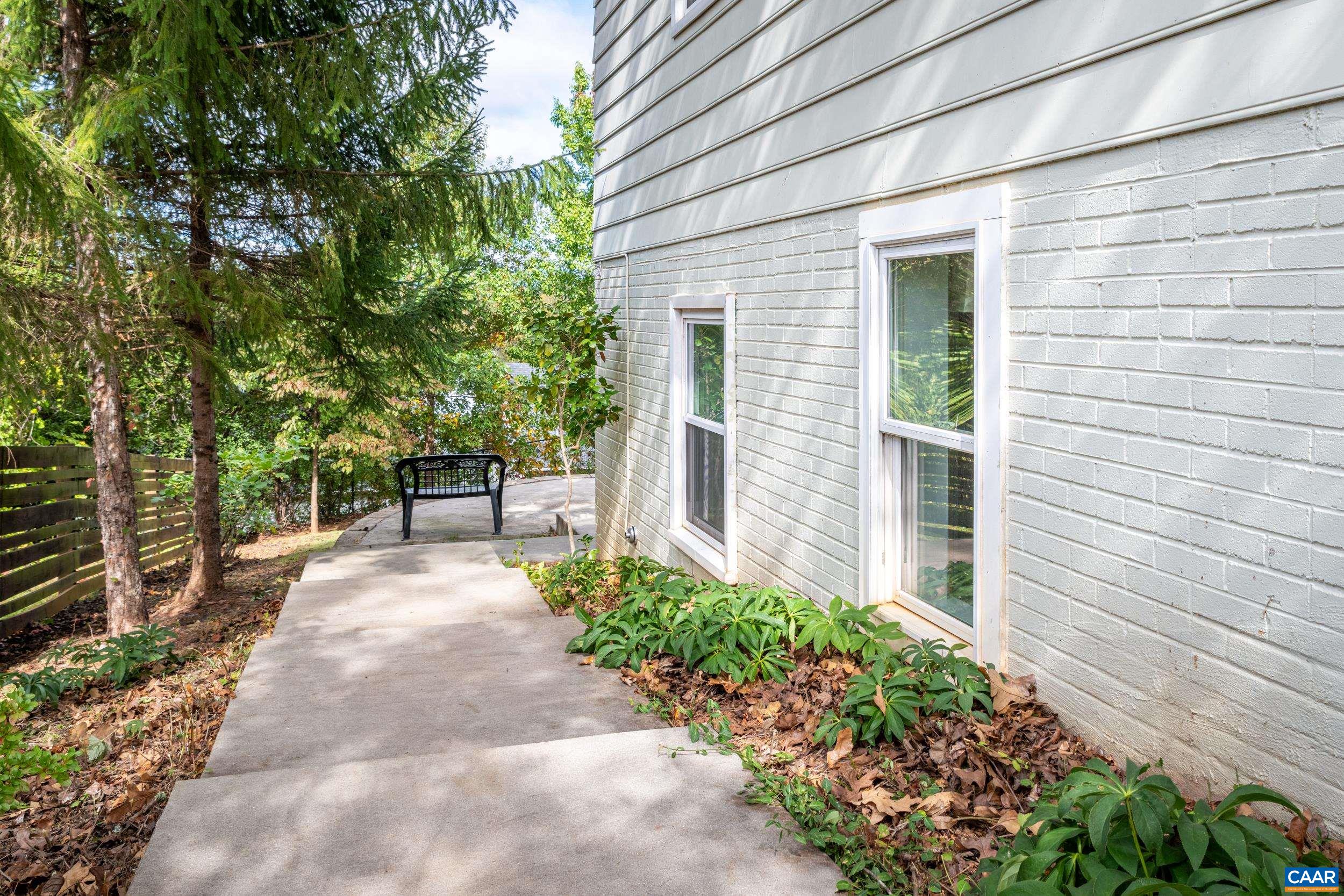 518 Jester Lane Charlottesville, VA 22911 - Photo 41 of 53 a view of a backyard with potted plants and a fountain