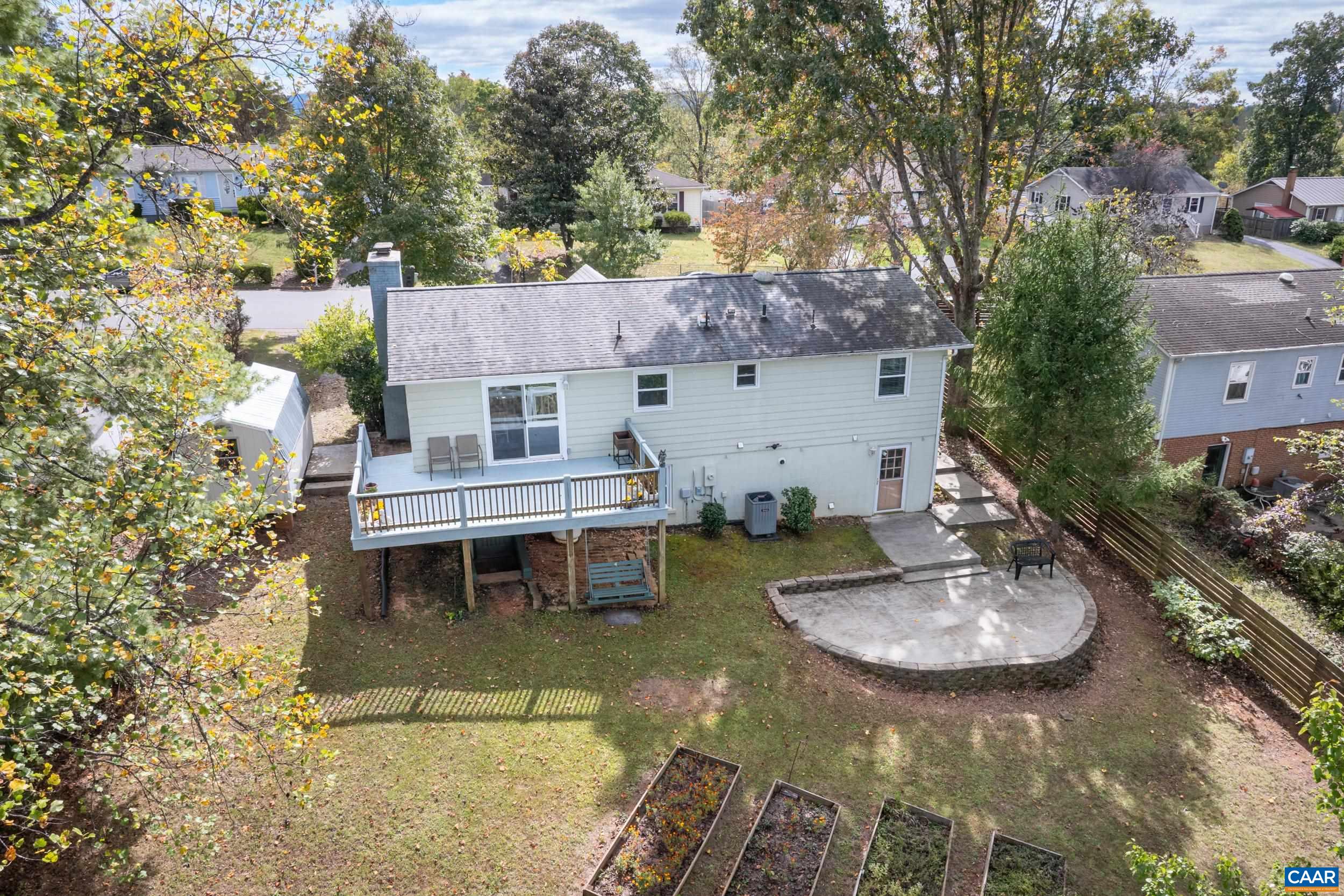518 Jester Lane Charlottesville, VA 22911 - Photo 45 of 53 a backyard of a house with yard table and chairs
