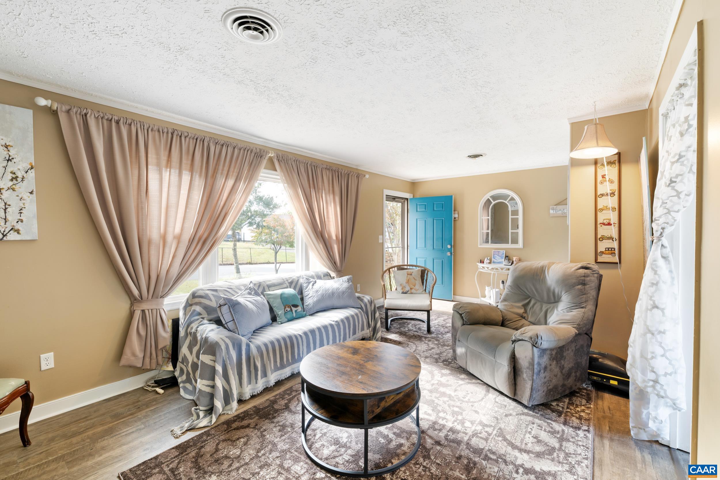 518 Jester Lane Charlottesville, VA 22911 - Photo 7 of 53 a living room with furniture and a large window
