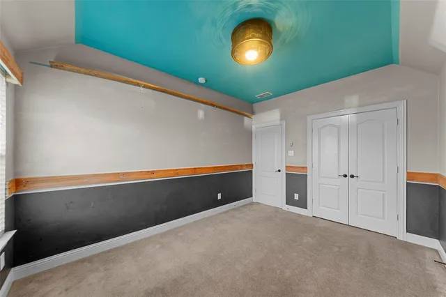 a view of an empty room and a window