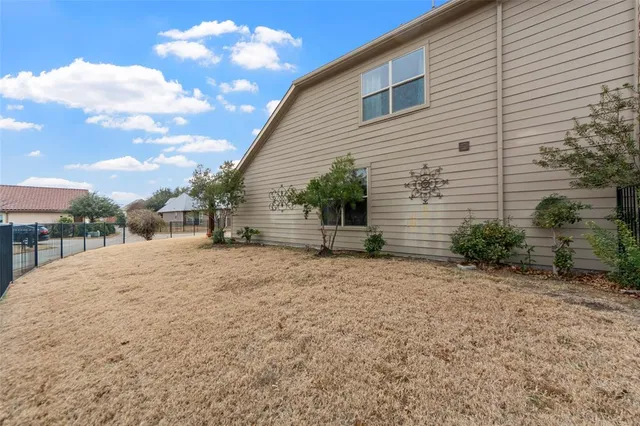 a view of a backyard of the house