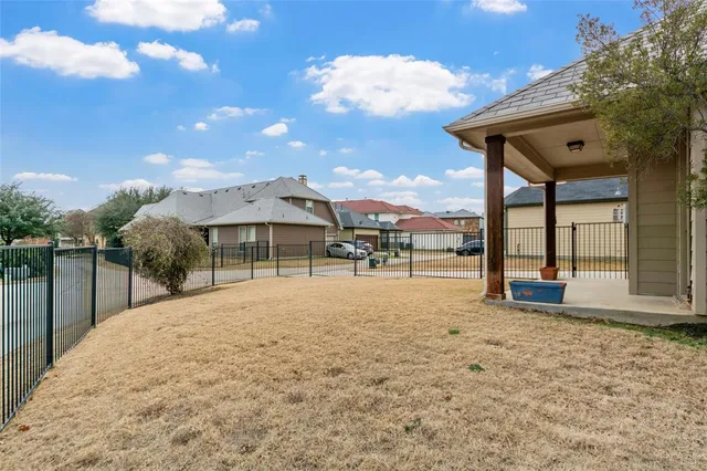 a house with yard and ocean view