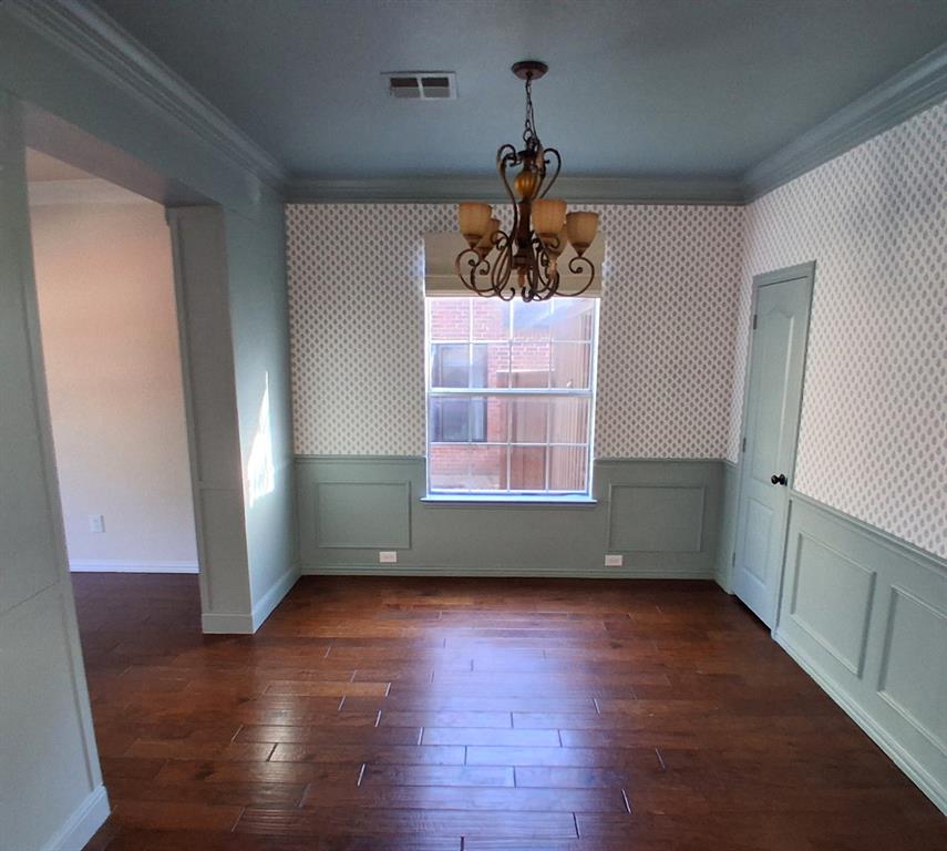 1123 Hampton Drive Allen, TX 75013 - Photo 13 of 33 an empty room with wooden floor a ceiling fan and windows