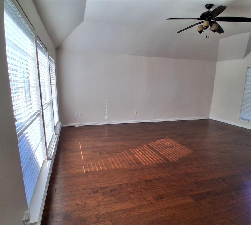 1123 Hampton Drive Allen, TX 75013 - Photo 21 of 33 a view of an empty room with wooden floor and a window
