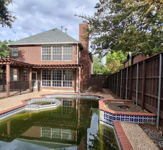 front view of house with a swimming pool