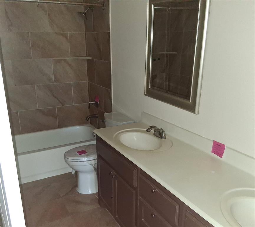 1123 Hampton Drive Allen, TX 75013 - Photo 25 of 33 a bathroom with a sink and a mirror