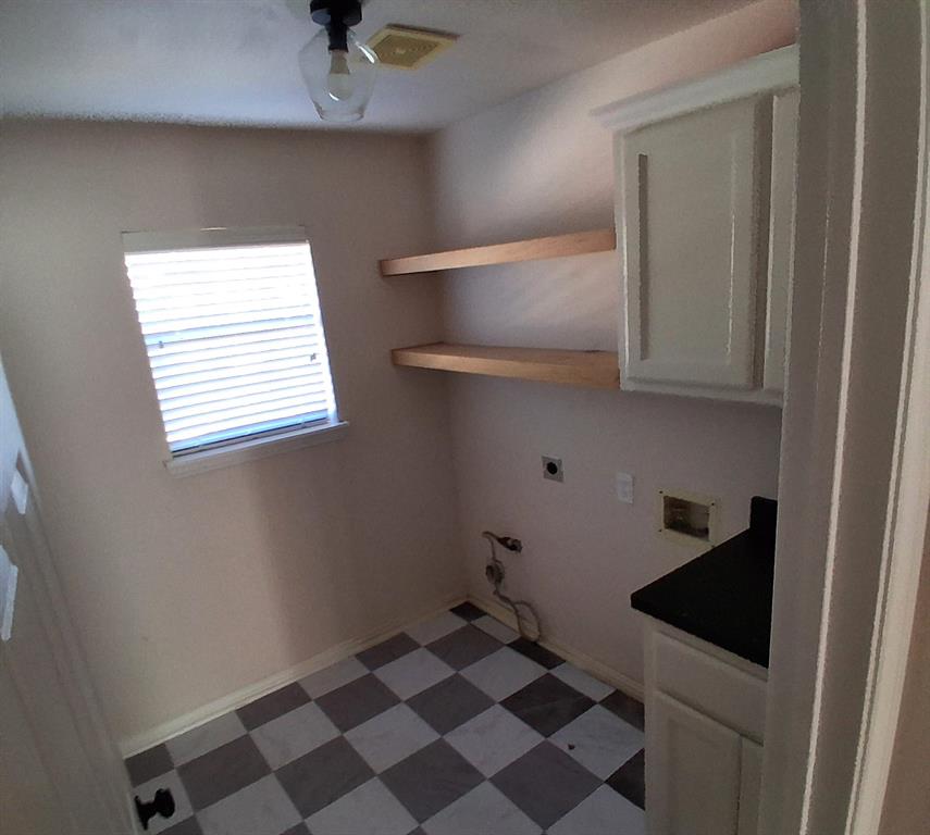 1123 Hampton Drive Allen, TX 75013 - Photo 28 of 33 a kitchen with a sink a refrigerator and cabinets