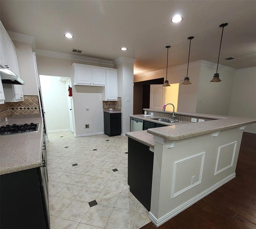 1123 Hampton Drive Allen, TX 75013 - Photo 4 of 33 a kitchen that has a sink a stove a refrigerator and a cabinets