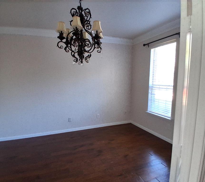 1123 Hampton Drive Allen, TX 75013 - Photo 10 of 33 a view of a small space with wooden floor and a window