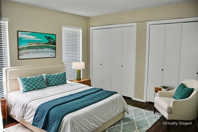 a bedroom with a bed and furniture