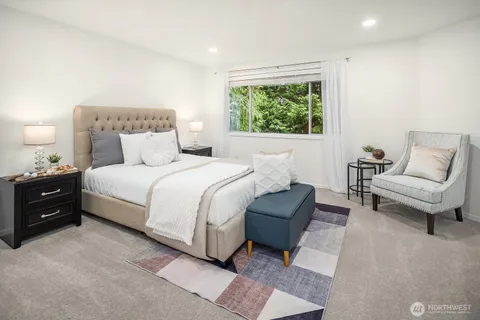 a bedroom with a bed and a couch