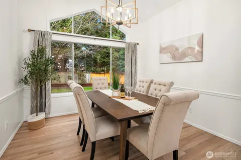 a view of a dining room with furniture window and outside view