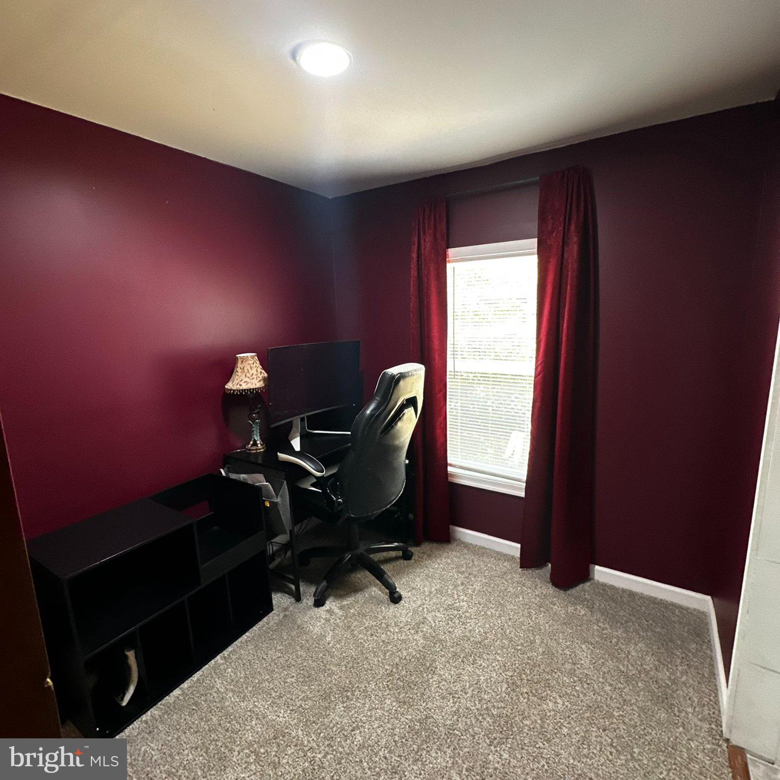 31777 Siham Road Lewes, DE 19958 - Photo 12 of 46 Cozy workspace with rich burgundy walls.