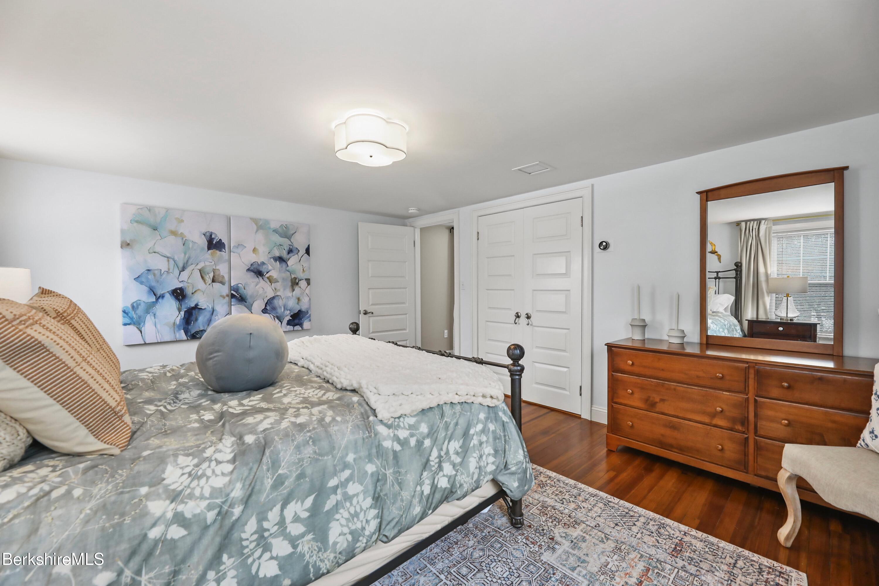 1 Devon Road Stockbridge, MA 01262 - Photo 24 of 58 a bedroom with a large bed and a dresser