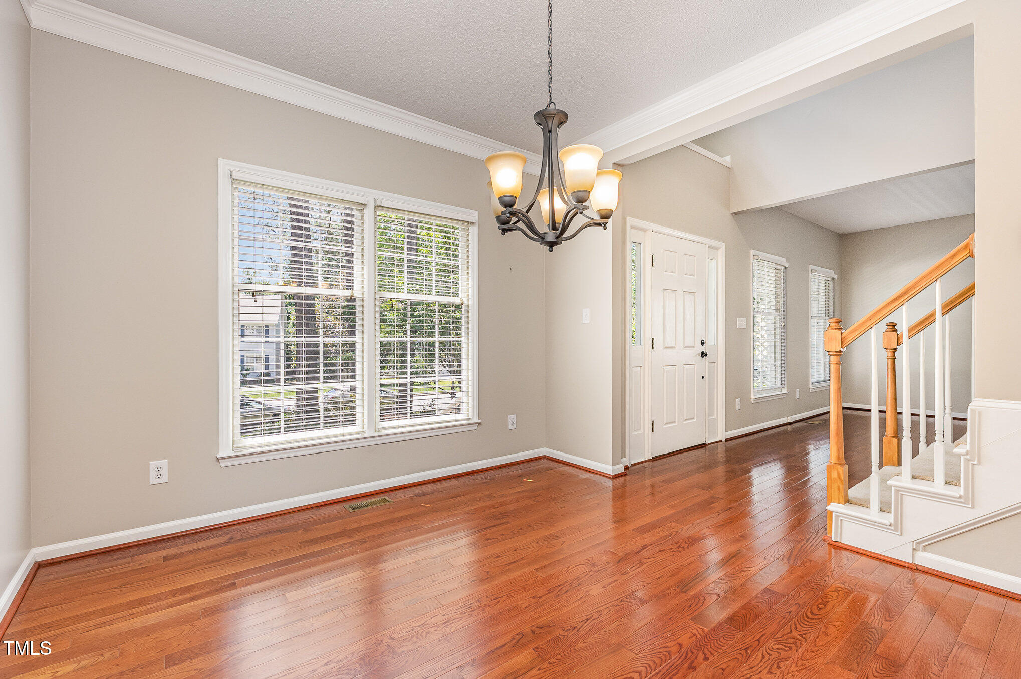 9308 Carisbrook Court Raleigh, NC 27615 - Photo 9 of 24 formal dining room looking at front door and living room