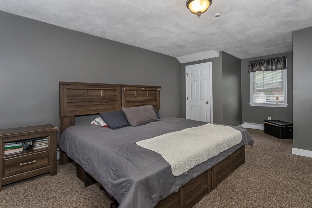 34 Fairview Road Canton, MA 02021 - Photo 11 of 23 a bedroom with a bed and a lamp