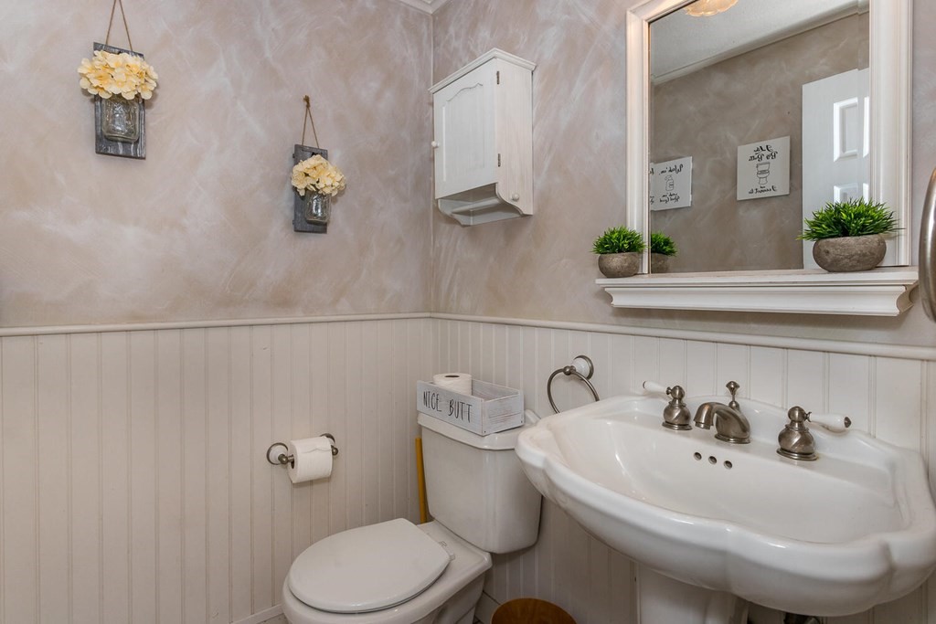 34 Fairview Road Canton, MA 02021 - Photo 8 of 23 a white toilet sitting next to a bathroom sink