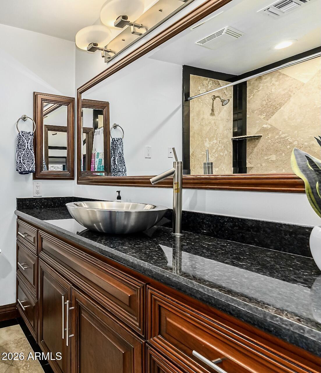 5760 North Scottsdale Road Paradise Valley, AZ 85253 - Photo 15 of 34 a bathroom with a sink a large mirror and a window