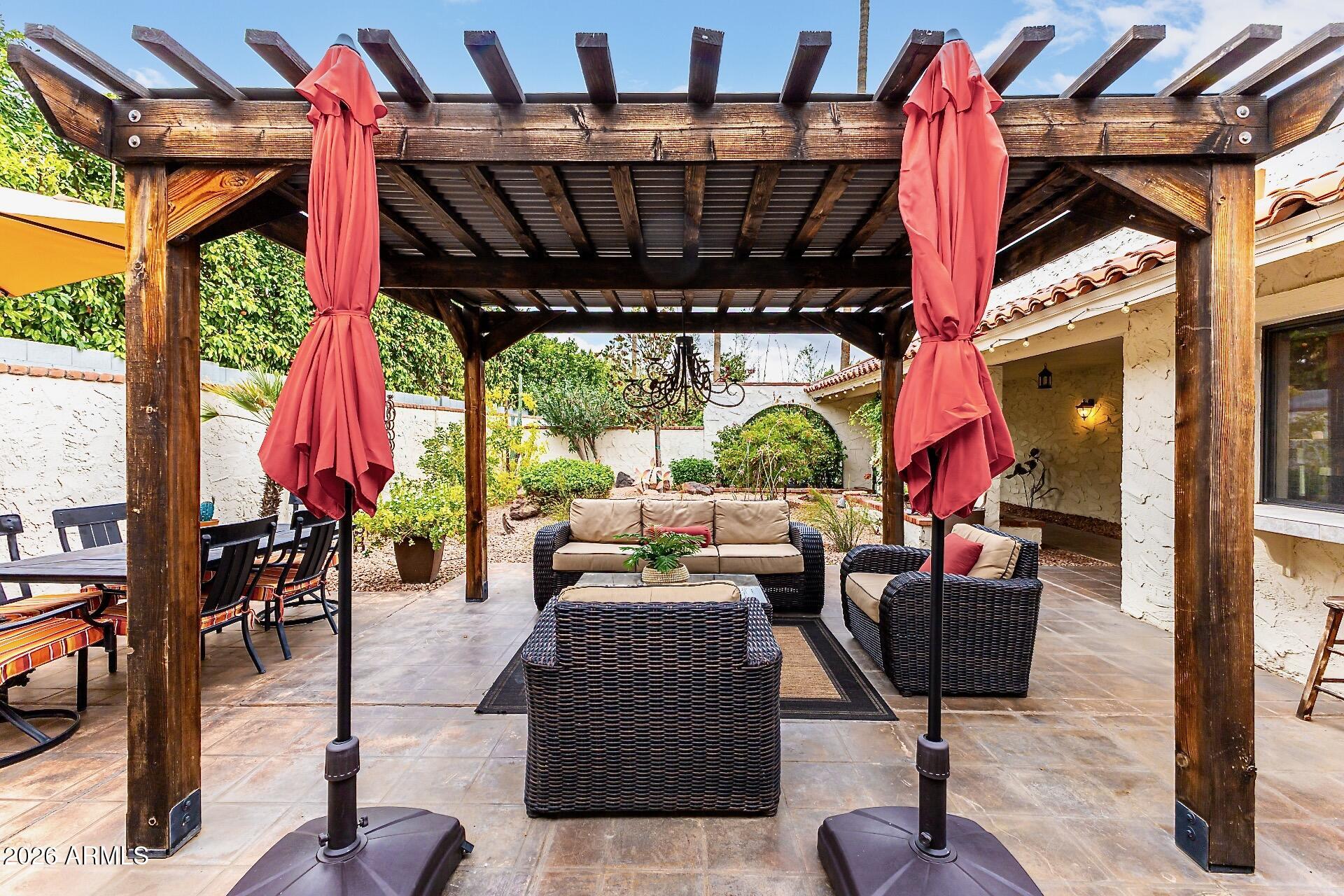 5760 North Scottsdale Road Paradise Valley, AZ 85253 - Photo 20 of 34 a outdoor space with the couches and dining table with the garden view