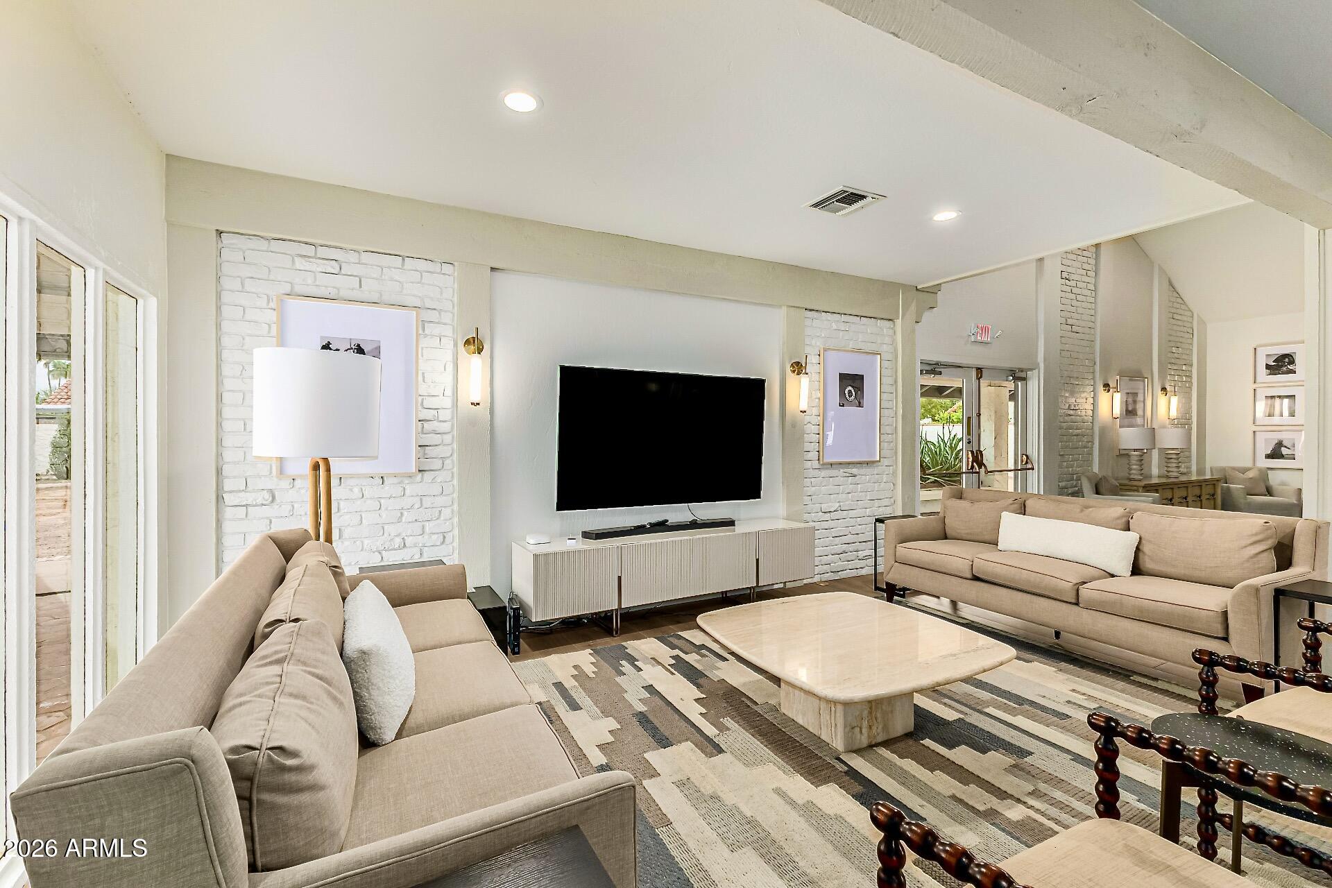 5760 North Scottsdale Road Paradise Valley, AZ 85253 - Photo 27 of 34 a living room with furniture and a flat screen tv